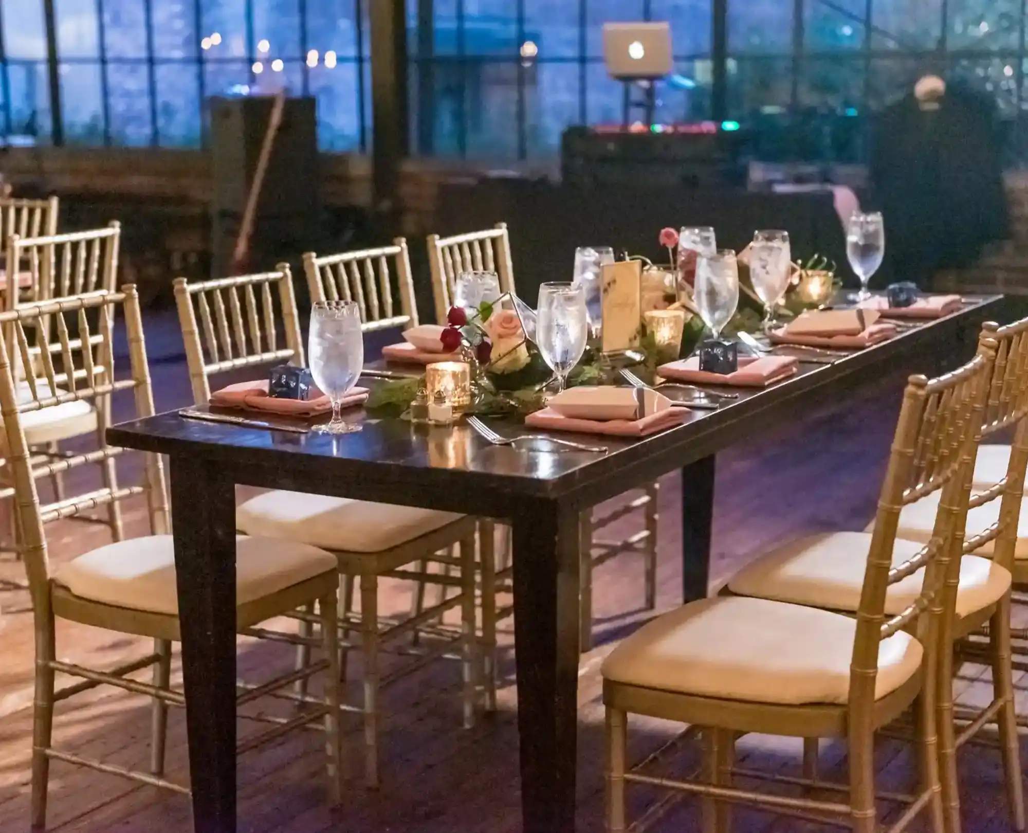 dark brown rectangular table surrounded by wooden chairs